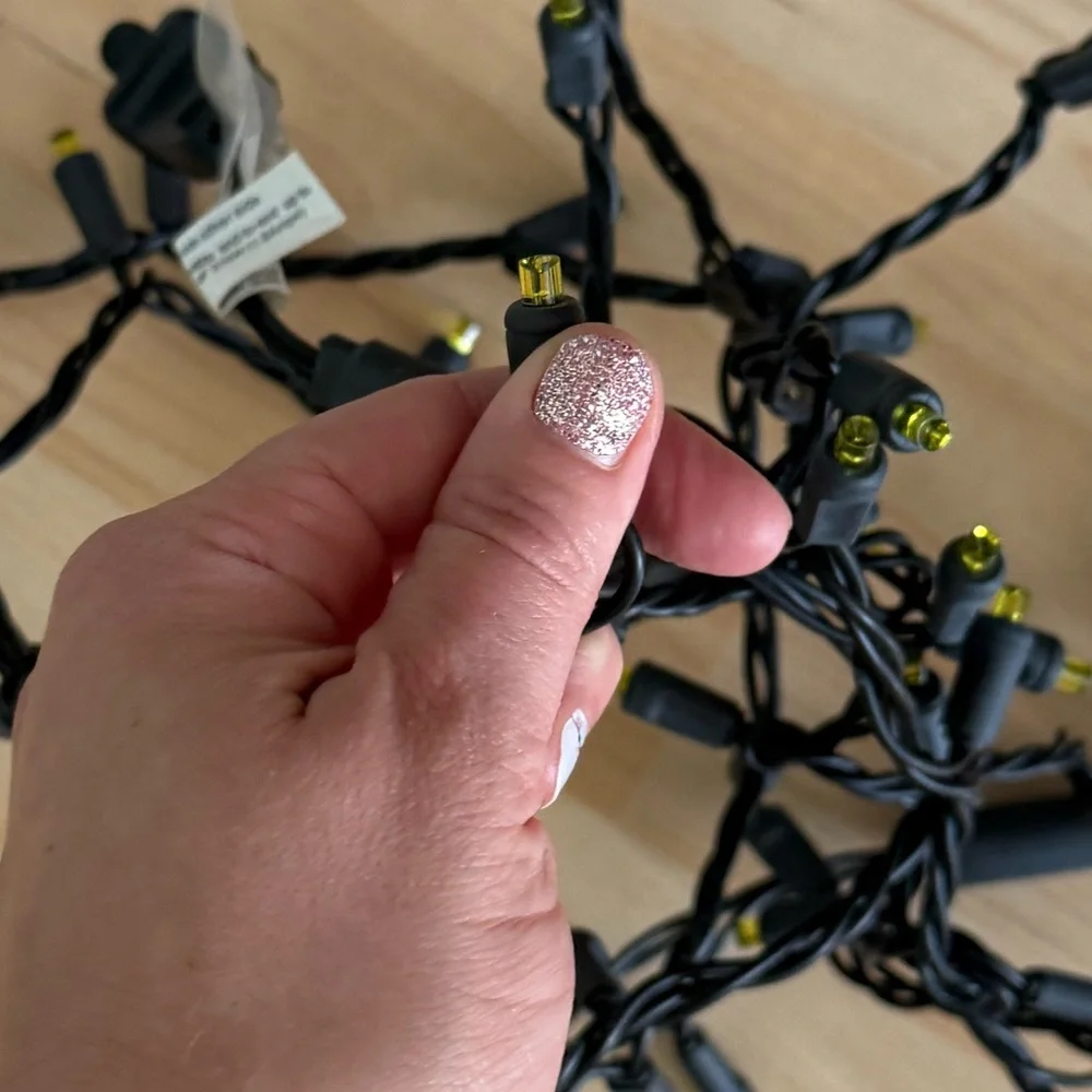 Festive Black String Lights with Yellow Tips